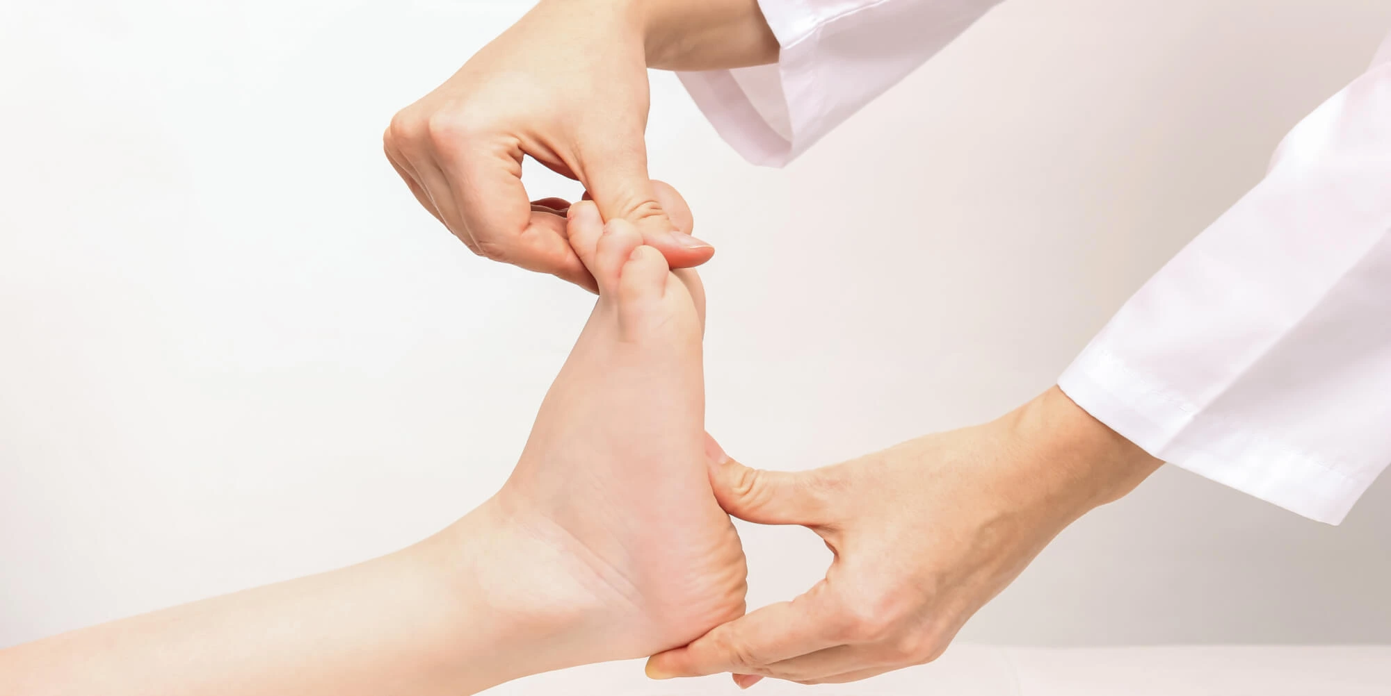 Podiatrist examining a patient's foot